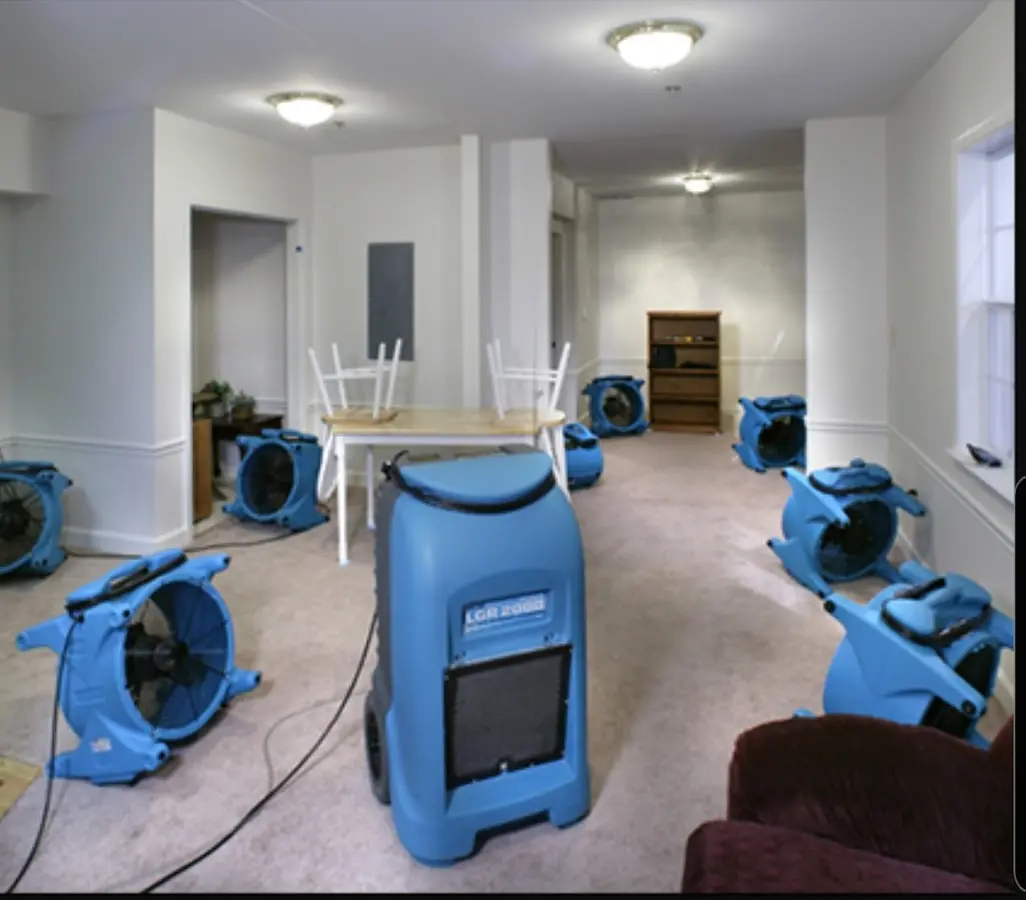 Air movers and dehumidifier setup for Water Damage Restoration in Waterbury